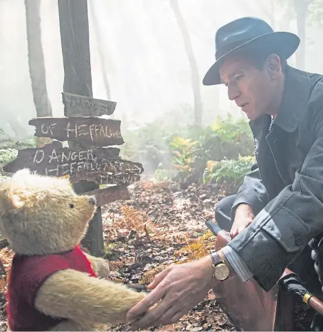  ?? Picture: PA. ?? Winnie-the-Pooh (voiced by Jim Cummings) with grown-up Christophe­r Robin (Ewan McGregor).