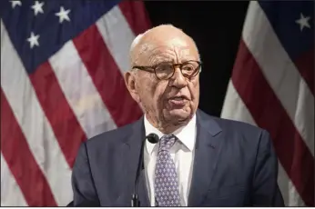  ?? MARY ALTAFFER — ASSOCIATED PRESS FILE ?? Rupert Murdoch introduces Secretary of State Mike Pompeo during the Herman Kahn Award Gala in New York in 2018. A lawsuit by Denver-based Dominion Voting System is offering a look at how Murdoch runs his media empire.