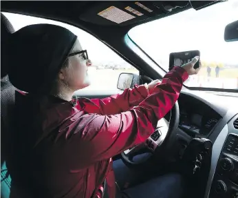  ??  ?? Reporter Andrea Hill tests out the challenges of distracted driving on a course set up by Saskatoon Police and SGI last fall. Letter writer Ken Morken is calling for tougher penalties for distracted drivers. MICHELLE BERG/FILES