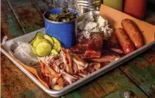  ?? PHOTOS COURTESY MIKE DISKIN ?? The Fat Cheeks Tray at Sweet Cheeks Q comes with pulled chicken and ribs that will be included in the Father’s Day Texas Smokehouse package