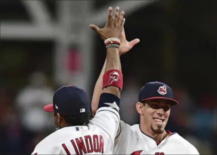  ?? DAVID DERMER — ASSOCIATED PRESS ?? Francisco Lindor, left, and Bradley Zimmer celebrate after a 7-2 win over the Yankees on Aug. 5.