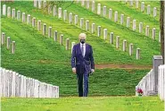  ?? ANDREW HARNIK/ASSOCIATED PRESS ?? President Joe Biden, who announced the withdrawal of the remainder of U.S. troops in Afghanista­n by Sept. 11, visits Arlington National Cemetery on Wednesday.