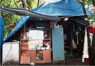  ??  ?? Makeshift house: A family of 13 was living in two plastic sheet tents before 4x4 Relief Malaysia built them a cabin home in Kelantan.