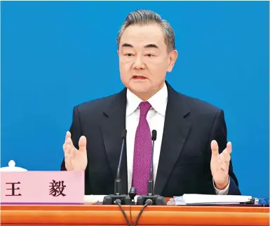  ?? Photo: Xinhua ?? Wang Yi speaks at a press conference on the sidelines of the fifth session of the 13th National People’s Congress.