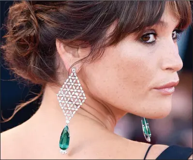  ??  ?? Green goddess: Gemma Arterton shows off the Chopard earrings at the Venice Film Festival