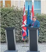  ??  ?? Mr Johnson being ‘empty lecterned’ by Luxembourg Prime Minister Xavier Bettel.