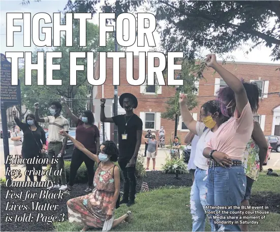  ?? KATHLEEN E. CAREY - MEDIANEWS GROUP ?? Attendees at the BLM event in front of the county courthouse in Media share a moment of
solidarity in Saturday.