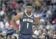  ?? THE ASSOCIATED PRESS FILE ?? Pelicans forward Zion Williamson walks onto the court against the Heat.