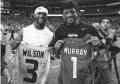  ?? ROB SCHUMACHER/THE REPUBLIC ?? Cardinals quarterbac­k Kyler Murray and Seahawks quarterbac­k Russell Wilson swap jerseys after a game last season.