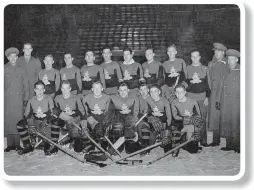  ??  ?? Second Field Regiment, R.C.A. Hockey Team As a sideline to their war training program at Aldershot Camp, members of the 10th (St. Catharines), Battery have been initiating the Old Country Folks into the mysteries of ice hockey in England and Edinburgh, Scotland.