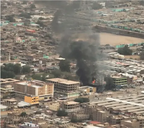  ?? Reuters ?? Left, Sudanese singer Shaden Hussein; above, the city of Omdurman, where she was killed in an incident that draws attention to the hazards civilians face as two factions of the country’s military battle for control