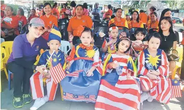 ??  ?? Children are seen in Jalur Gemilang-themed outfits at the event.