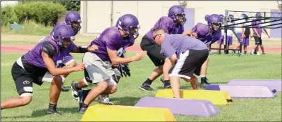  ?? PHOTOS BY MIKE BUSH/NEWS-SENTINEL ?? Above: A group of Tokay High football players work on a blocking drill during Thursday's practice at Hubbard Field. Below: A group of Tokay High football players work on a blocking drill during Thursday's practice.