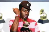  ??  ?? US rapper Tyler, the Creator poses in the press room with the award for Best Rap Album for “Igor”.