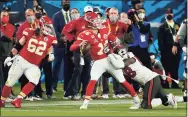  ?? Doug Benc / Associated Press ?? Pat Mahomes (15) attempts to get off a pass while being pressured by the Buccaneers’ Shaquil Barrett during Super Bowl 55 on Sunday in Tampa, Fla.