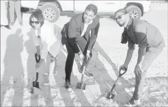  ?? ?? Minister of Culture, Youth and Sports Charles S Ramson Jnr (centre) flanked by investor Hesaan DaSilva (left) and son Aaron DaSilva (right) as they turned the sod