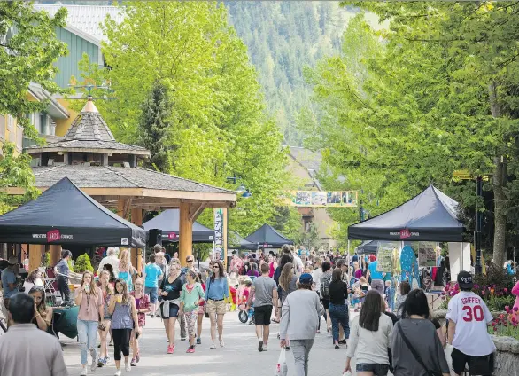  ?? MIKE CRANE/TOURISM WHISTLER ?? Thousands of Whistler Village visitors enjoy the GO Fest on the Victoria Day weekend in 2015. RCMP say the holiday has been a challenge in the past.