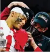  ?? AP ?? Ohio State head coach Ryan Day hugs quarterbac­k Justin Fields after their win against Clemson in the Sugar Bowl Jan. 1.