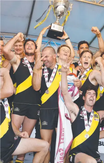  ?? Picture: JERAD WILLIAMS ?? Labrador celebrate their second successive QAFL premiershi­p in 2016.