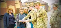  ?? COURTESY PHOTO ?? Maj. Scott Eberlein (second from right) meeting with civil leaders in Poznan, Poland, in 2019.