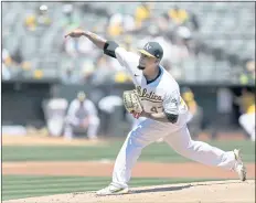  ?? PHOTOS BY TONY AVELAR — THE ASSOCIATED PRESS ?? Frankie Montas of the A’s gave up just two runs with seven strikeouts over six innings, but took the loss against the Indians on Saturday at the Coliseum.