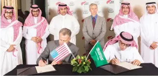 ??  ?? The two companies signed a joint memorandum of understand­ing (MoU) committing to the IKTVA program in an effort to achieve Saudi Arabia’s Vision 2030 initiative.
