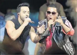  ?? Lynne Sladky Associated Press ?? HIT SONG “Despacito,” by Luis Fonsi, left, and Daddy Yankee, snagged two major nomination­s in the song categories: record of the year and song of the year.