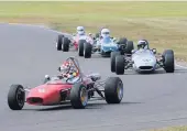  ??  ?? ● Action from the Tom Pryce Memorial Meeting at Anglesey Circuit. Above, pit lane applause in memory of Tom Pryce - the car is his F3. Pictures: Paul Lawrence