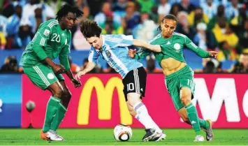  ??  ?? Super Eagles players tackle Argentina’s Lionel Messi at Brazil 2014 World Cup in their group match, which ended 3-2 in favour of Argentina