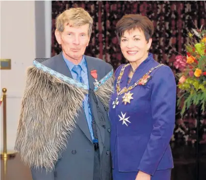  ??  ?? George Burt with Governor-General Patsy Reddy who presented him the New Zealand Order of Merit in Wellington.