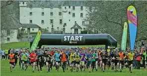  ??  ?? On the run: The obstacle race gets under way near Traquair House