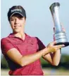  ?? — Reuters ?? England’s Georgia Hall celebrates winning the Women’s British Open with the trophy.