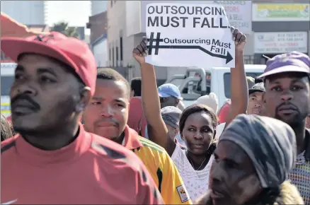  ?? PICTURE: OUPA MOKOENA ?? OUTRAGED: Members of the #Outsourcin­gMustFall movement march to the Department of Higher Education in Pretoria to hand over a memorandum of grievances.