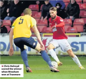  ??  ?? > Chris Holroyd scored the winner when Wrexham won at Tranmere