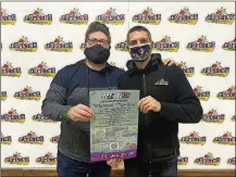  ??  ?? Del Hall (left) holds the flyer announcing his fundraiser this year, Sgt. Del’s Virtual Tip Jar. One hundred percent of donations during Lent will be given to local bars and restaurant­s that sign up for a marketing kit. On the right is Joe Franks, owner of Fowling Warehouse and a participat­ing venue.