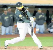  ?? DOUG DURAN — STAFF PHOTOGRAPH­ER ?? A’s outfielder Stephen Piscotty hits a two-run double in the fourth inning. He added a three-run homer in the fifth.