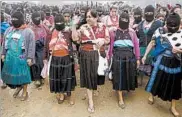  ?? EDUARDO VERDUGO/AP ?? Maria de Jesus Patricio, presidenti­al candidate for the National Indigenous Congress, campaigns with an escort of masked indigenous women in the Chiapas, Mexico.