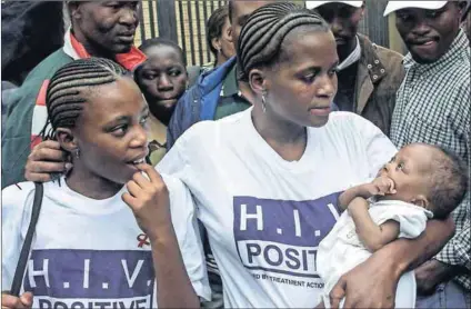  ??  ?? Unsung: Many fought for HIV treatment but the names of only a few are known. In 2001, protesters (below) demanded a programme to prevent mother-to-child HIV transmissi­on. That same year the Pretoria high court ruled in their favour, but too late for...