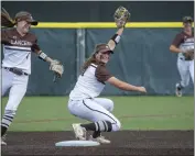  ?? ?? St. Francis' Jessica Oakland completes a double play at second base for the final out of Saturday's game.