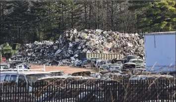  ?? Lori Van Buren / Times Union ?? Metal debris piles and trashed cars at Planit Salvage are seen from deck of a home nearby on Dec. 7 in Ballston Spa.