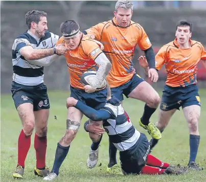  ??  ?? Ali Mackie, above, tries to work his way through the Kelso defence while Isoa Matacagi, right, runs with the ball.