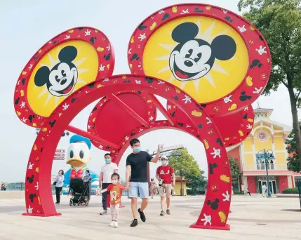  ??  ?? The reopening of Shanghai Disneyland is symbolic. — Photos by Wang Rongjiang