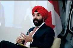  ?? CP PHOTO JUSTIN TANG ?? Minister of Innovation, Science and Industry Navdeep Bains responds to a reporter’s question on the government’s decisions regarding domestic production of a COVID-19 vaccine, after the announceme­nt of the 50 – 30 Challenge in Ottawa, on Dec. 10