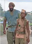  ?? SHAWN GREENE ?? Idris Elba and 15-year-old Abraham Attah are generating Oscar buzz as the principals of Beasts of No Nation.