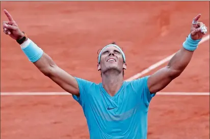  ?? MICHEL EULER/AP PHOTO ?? Rafael Nadal celebrates winning the men’s final of the French Open against Dominic Thiem on Sunday at Paris.