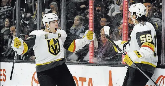  ?? Mark J. Terrill ?? The Associated Press Golden Knights left wing Erik Haula, right, celebrates his first-period goal with left wing David Perron on Monday night. The Knights yielded a late goal and lost in overtime.