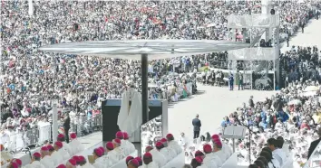  ?? — AFP ?? Pope Francis celebrates a centenary mass marking the apparition of the Virgin Mary at Fatima’s Sanctuary, central Portugal, on Saturday.