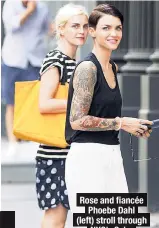  ??  ?? Rose and fiancée
Phoebe Dahl ( left) stroll through NYC’s Soho on Friday.