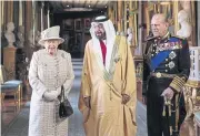  ?? ?? COURTING ROYALTY: UAE President Sheikh Khalifa bin Zayed al-Nahyan walks with Queen Elizabeth II and Prince Philip during his trip to Britain in this 2013 file photo.