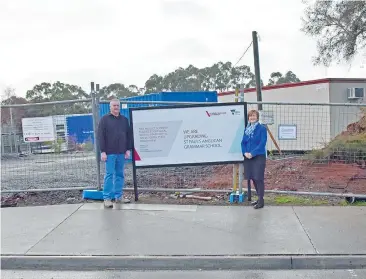  ??  ?? St Paul’s Anglican Grammar School project manager Murray Davidson and principal Lisa Moloney look over the site of a major new secondary school building expected to be completed by April next year.